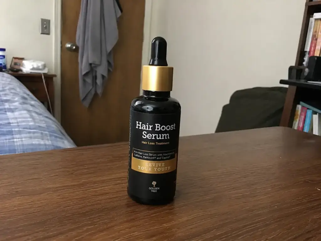 Hair Boost Serum on a wooden table