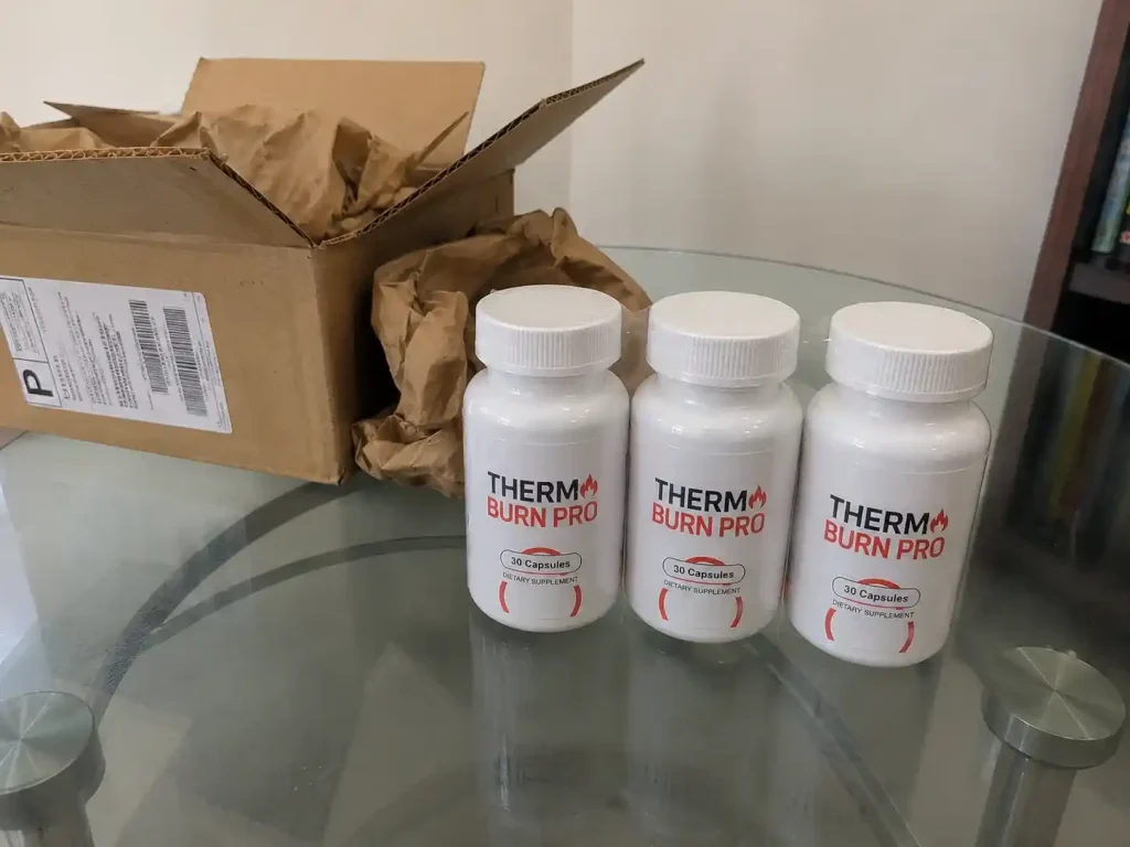 Thermo Burn Pro unboxing with three supplement bottles.