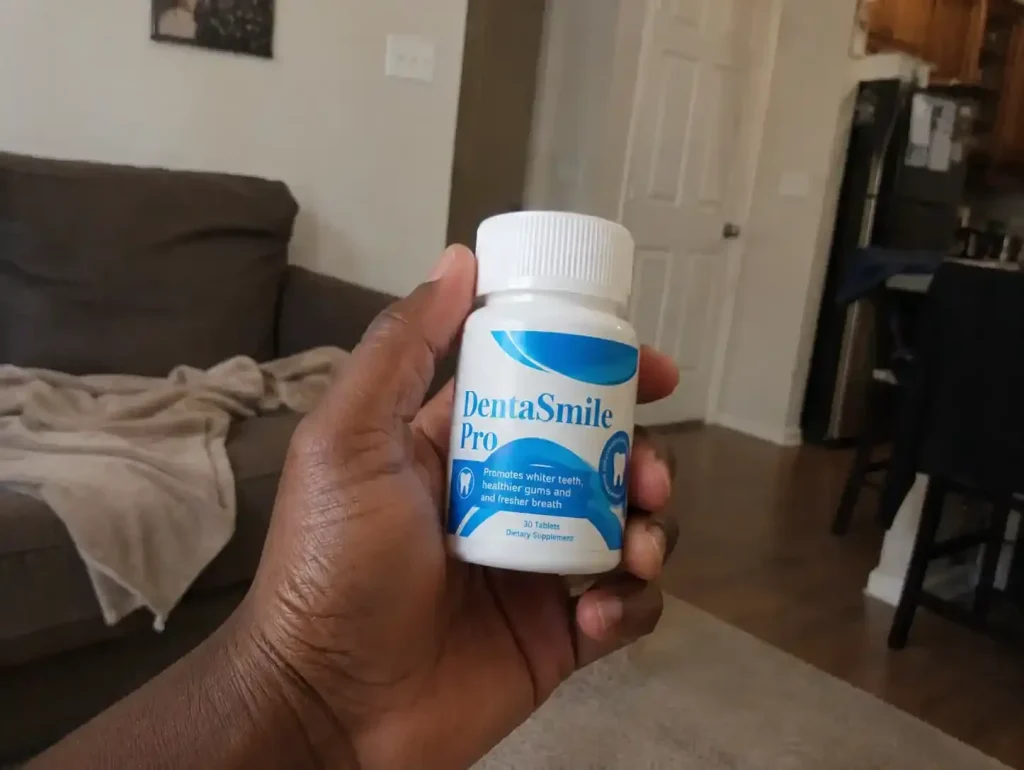 Denta Smile Pro supplement bottle in hand