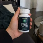 hand holding Memo Matrix supplement bottle