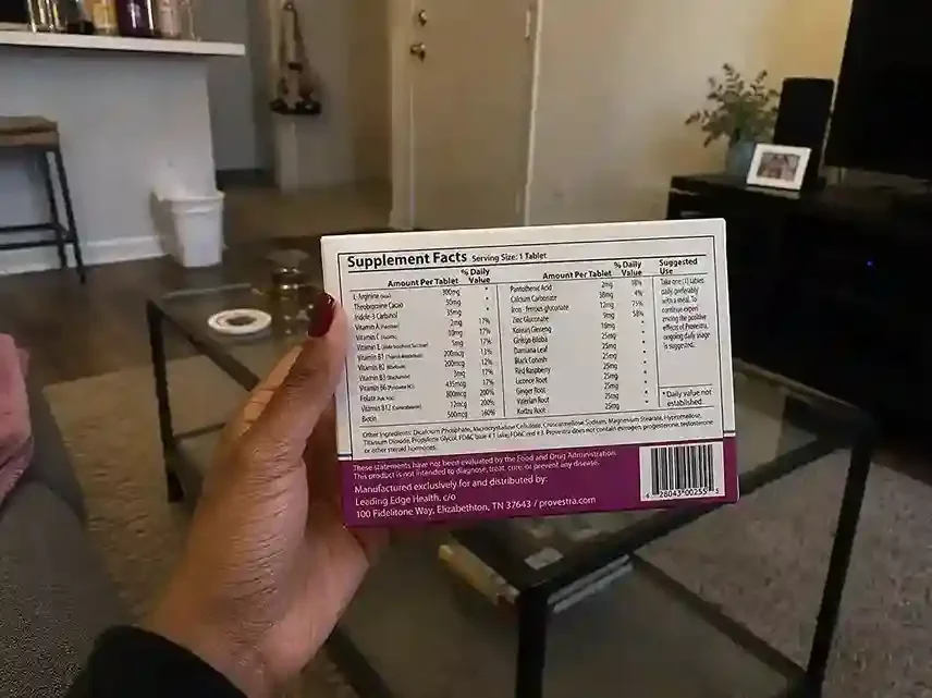 hand holding Provestra supplement box showing its facts