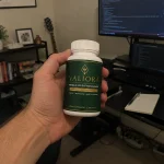 hand holding Valiora supplement boottle