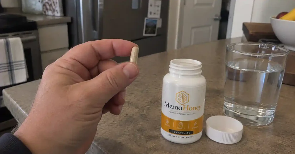 Hand holding Memo honey capsules