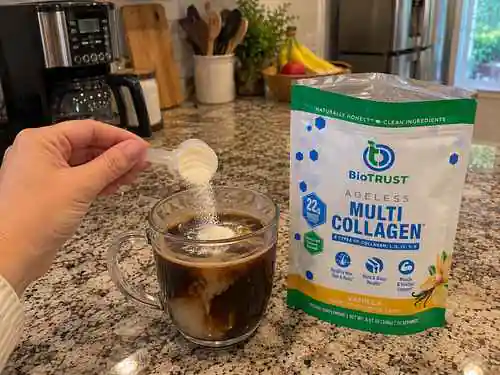 ageless muti collagen protein powder mixing in coffee