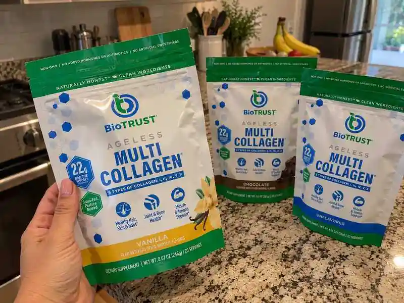 hand holding biotrust ageless muti collagen supplement bag