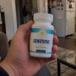 hand holding dentivive supplement bottle