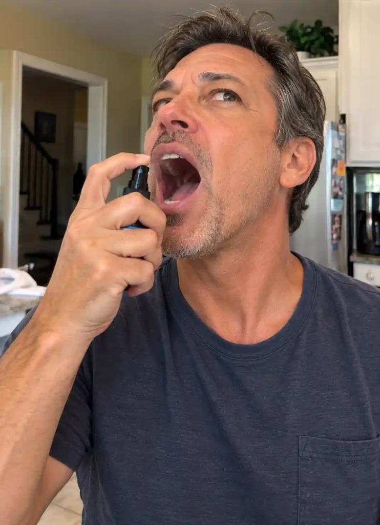 man using BreathiZen spray