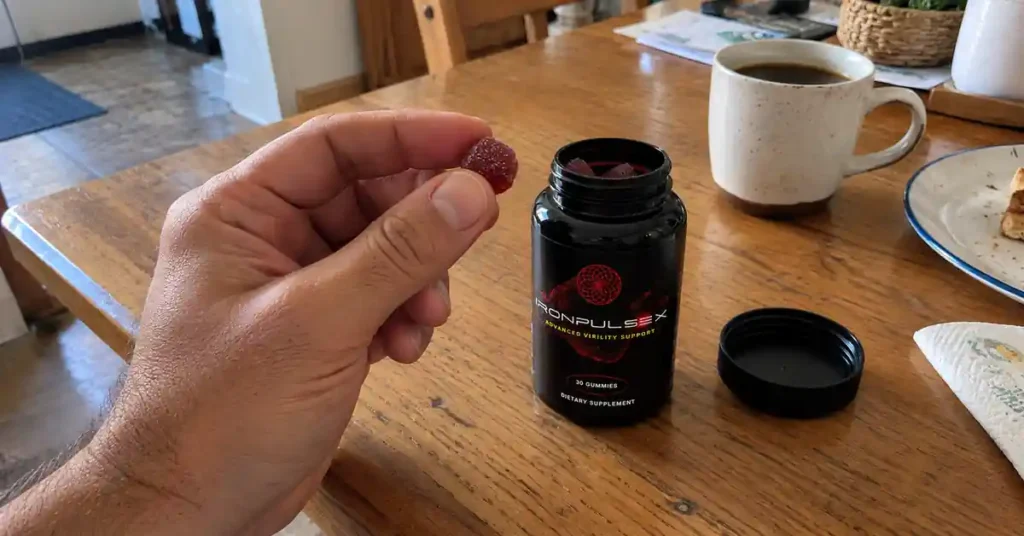 hand holding IronPulseX gummies