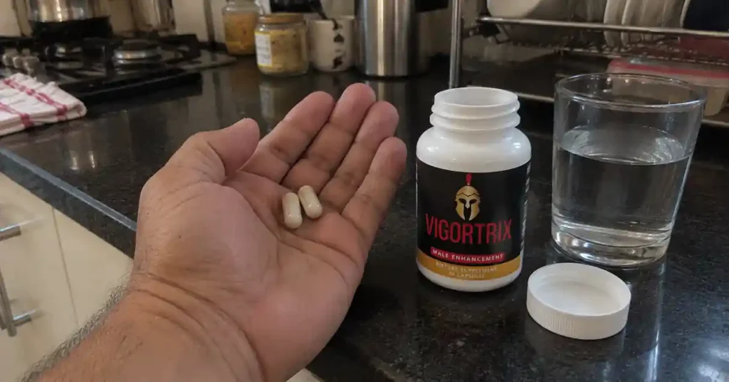 hand holding Vigortrix capsules